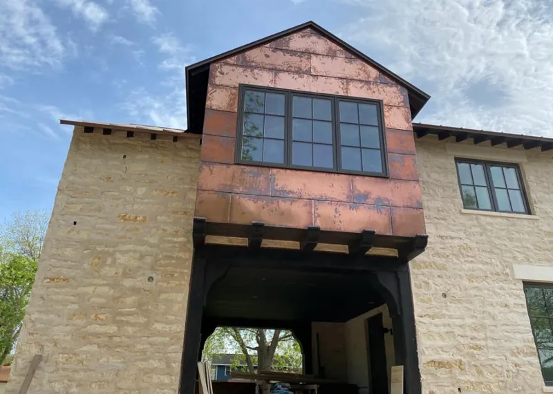 Copper metal panel facade on a stone building for Metal Roof Coating in Rio Vista