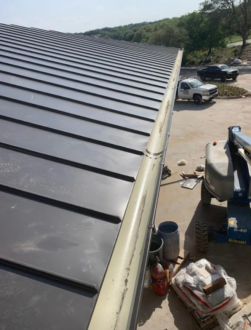 Standing seam panel and gutter detail on a metal roofing jobsite in Rio Vista